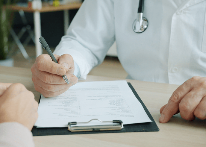 Doctor paperwork pexels-silverkblack-39192334